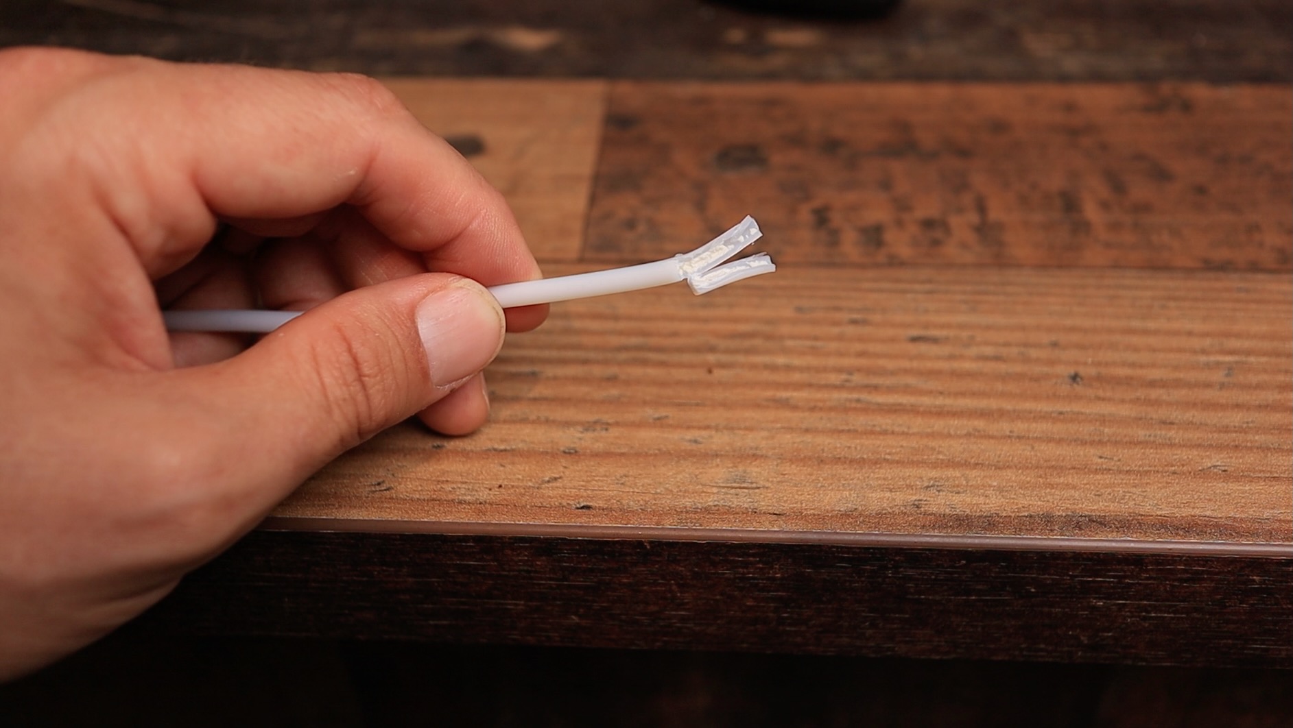 Close up picture of a PTFE line from an espresso machine, clogged with scale